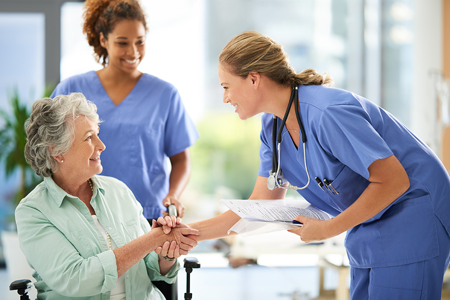 Nurses talking to a patient